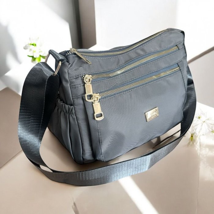 Bolsa crossbody para dama con múltiples compartimentos