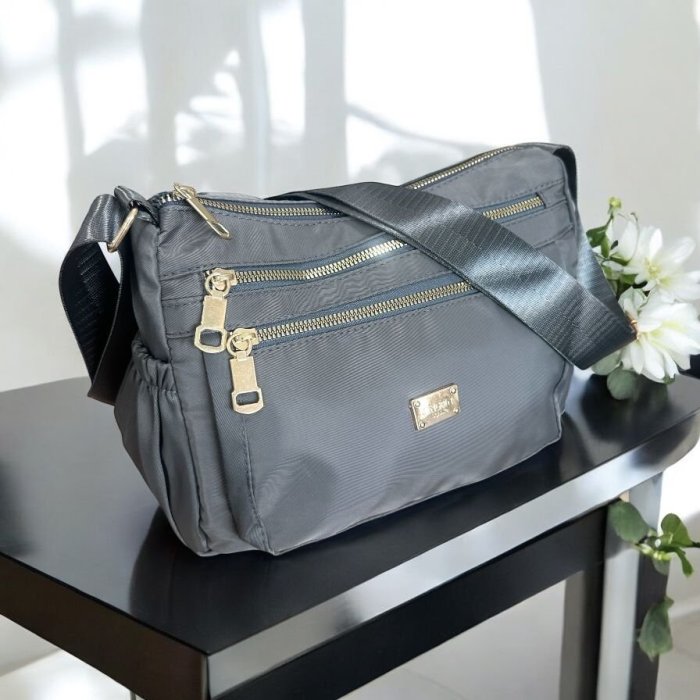 Bolsa crossbody para dama con múltiples compartimentos