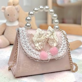 Bolsa infantil rosa coquette con cadena y asa decorativa