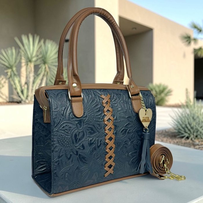 Bolsa de piel para dama con diseño artesanal y correa larga