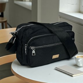 Bolso crossbody compacto con múltiples compartimentos