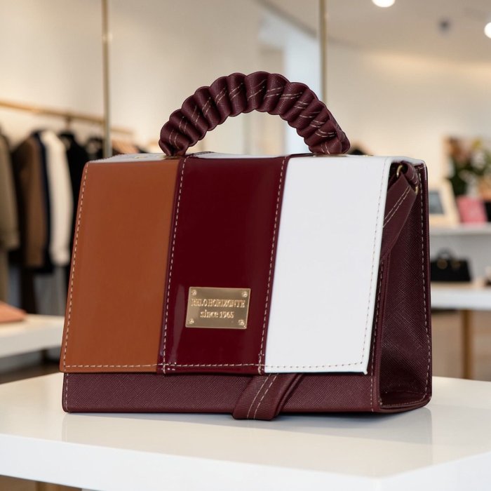 Bolsa estructurada tricolor vino con asa fruncida