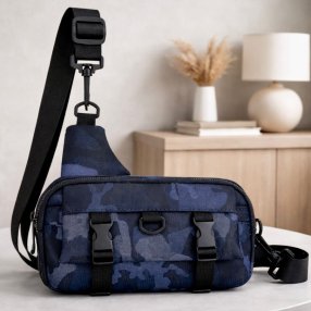 Bandolera tipo sling con múltiples compartimentos