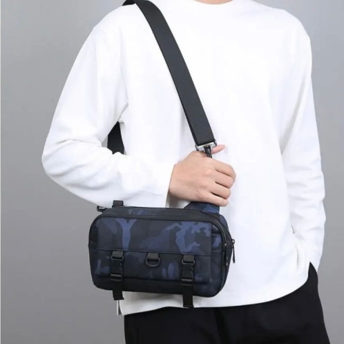 Bandolera tipo sling con múltiples compartimentos