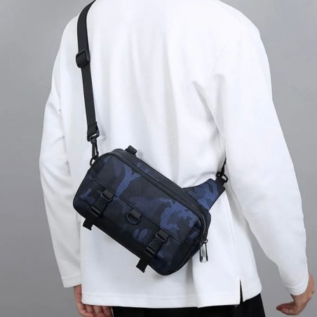 Bandolera tipo sling con múltiples compartimentos