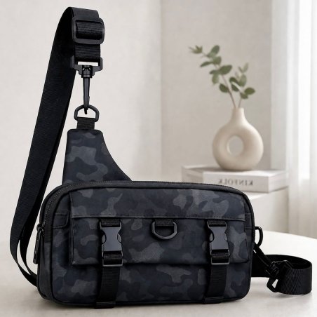 Bandolera gris tipo sling con múltiples compartimentos